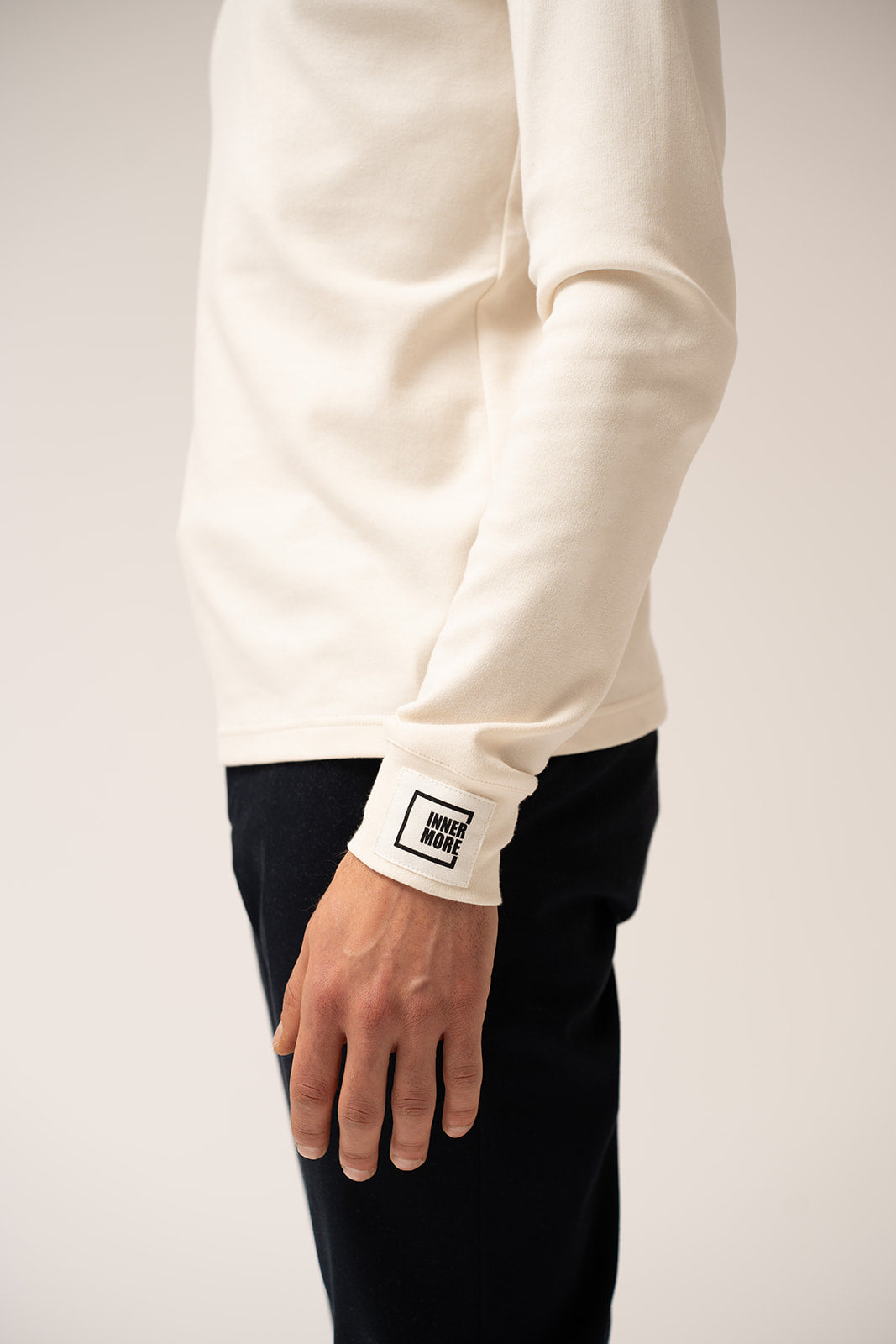 White long-sleeve shirt with an Innermore logo on a plain background